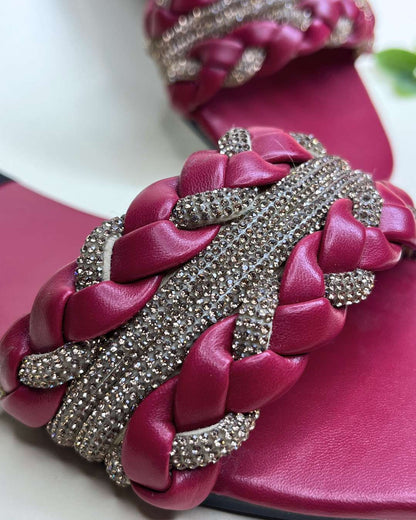 Elegant braided women flats featuring crystal accents on a neutral background