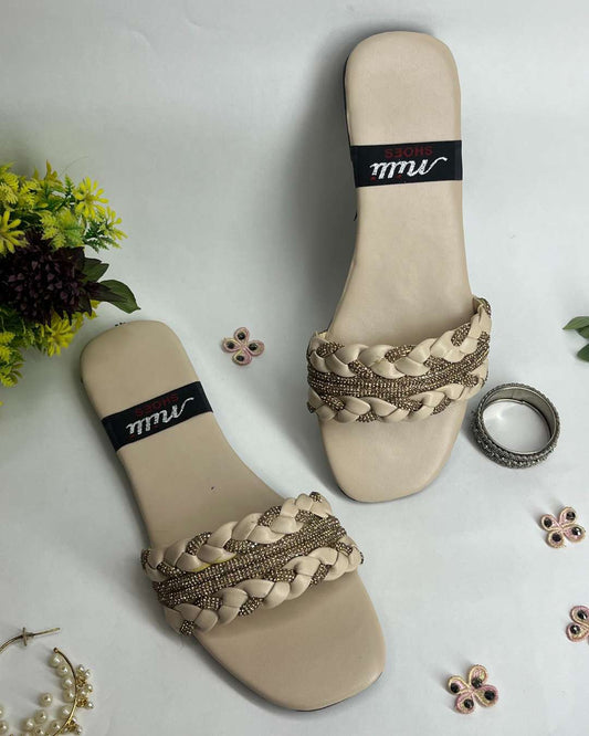 Women braided flats with crystal detailing and elegant design on a light background