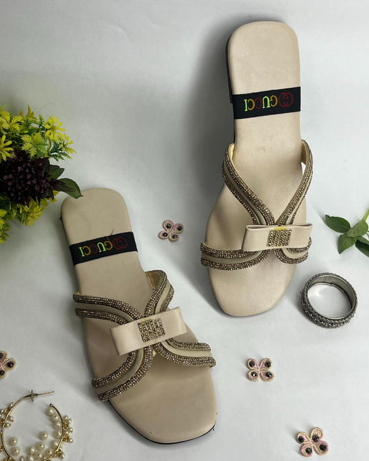 Beige women luxe flats with sparkling cross strap design