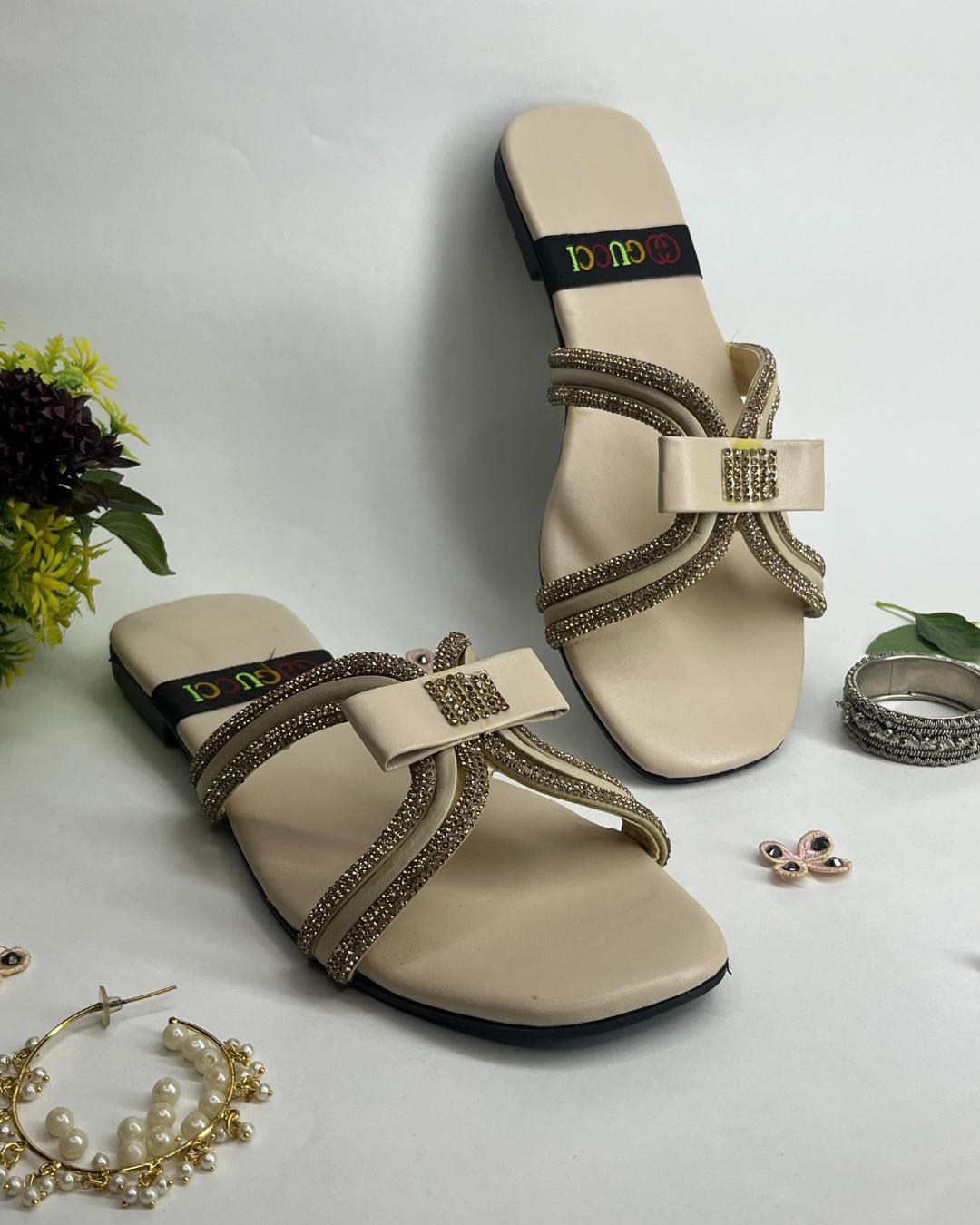 Beige women luxe flats with sparkling cross strap design