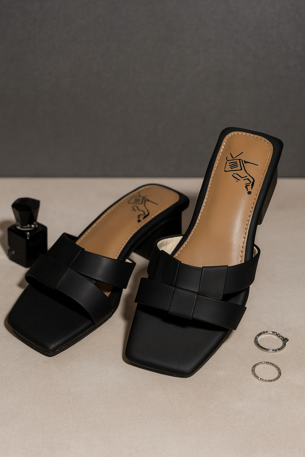 Flip Liper black bow-knot block heel sandals with tan insole displayed on a studio background
