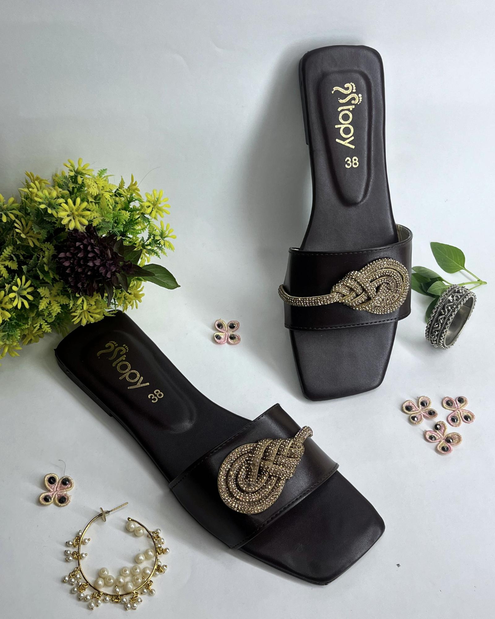 Dark brown women flats featuring crystal knot embellishment