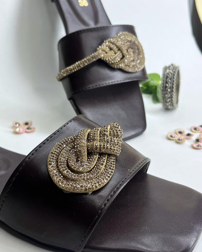 Dark brown women flats featuring crystal knot embellishment