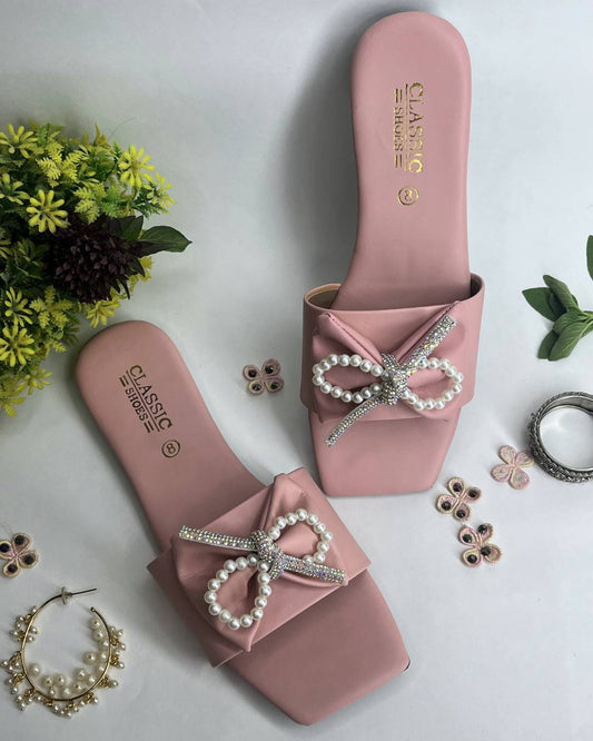 Pink women luxe flats featuring pearl bow embellishment